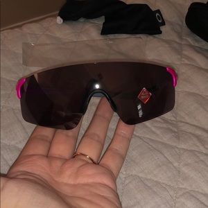 Pink and grey Oakley sunglasses